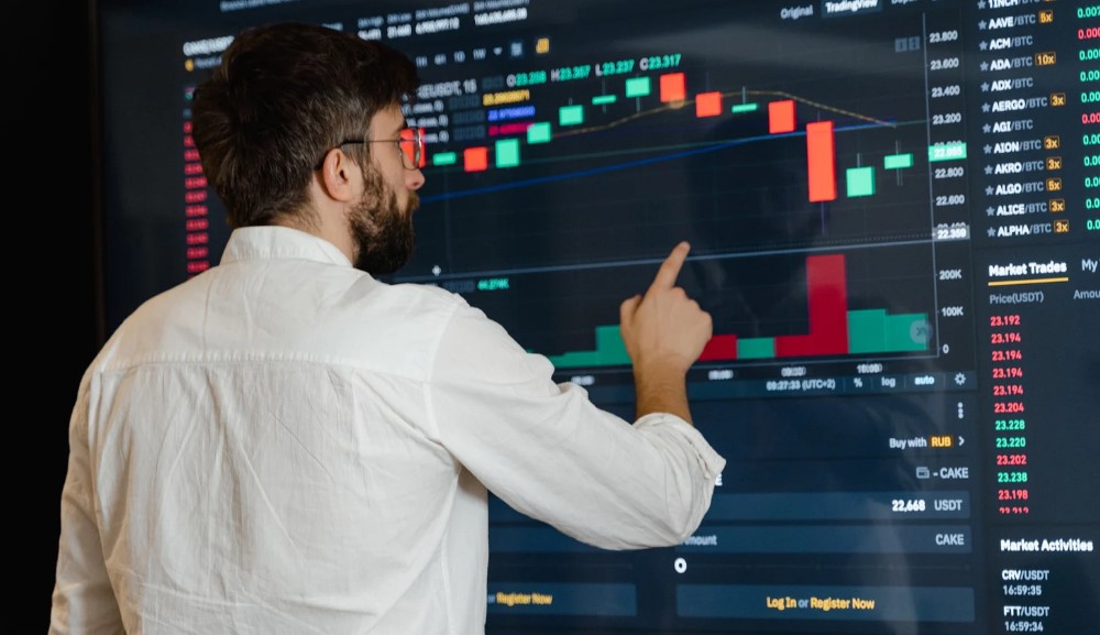 Trader touching trading app on a large TV screen